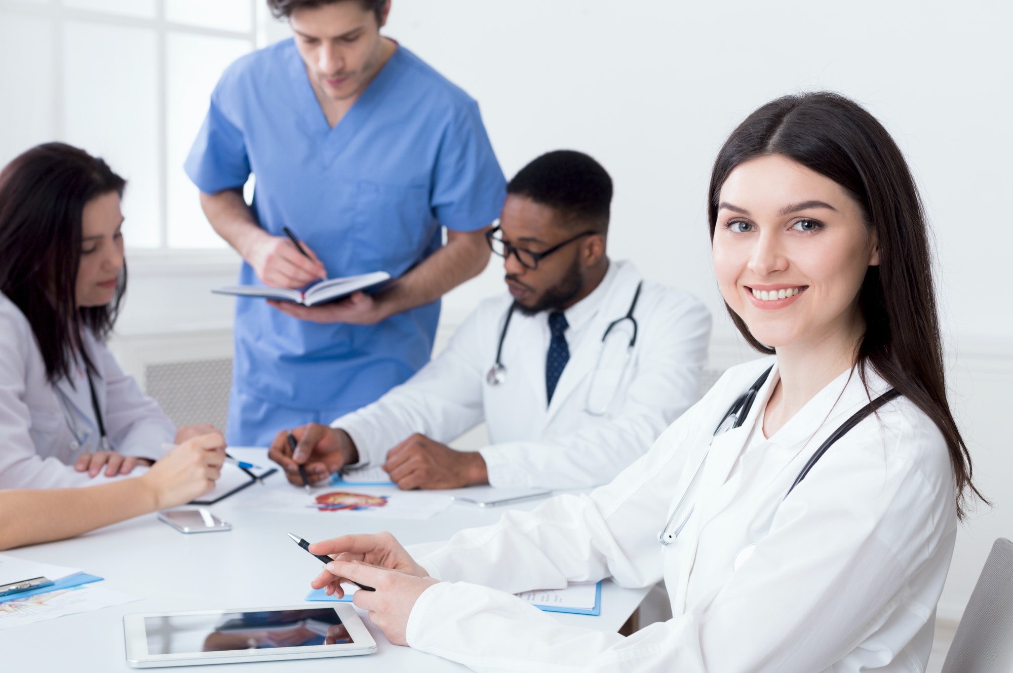 team of doctors having meeting in medical office