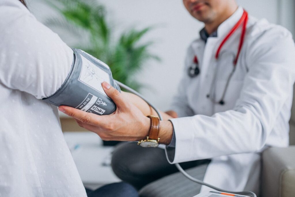 Doctor measuring blood pressure.