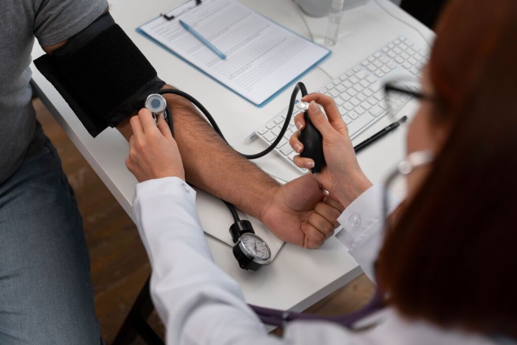 patient undergoing a physical exam with a doctor.