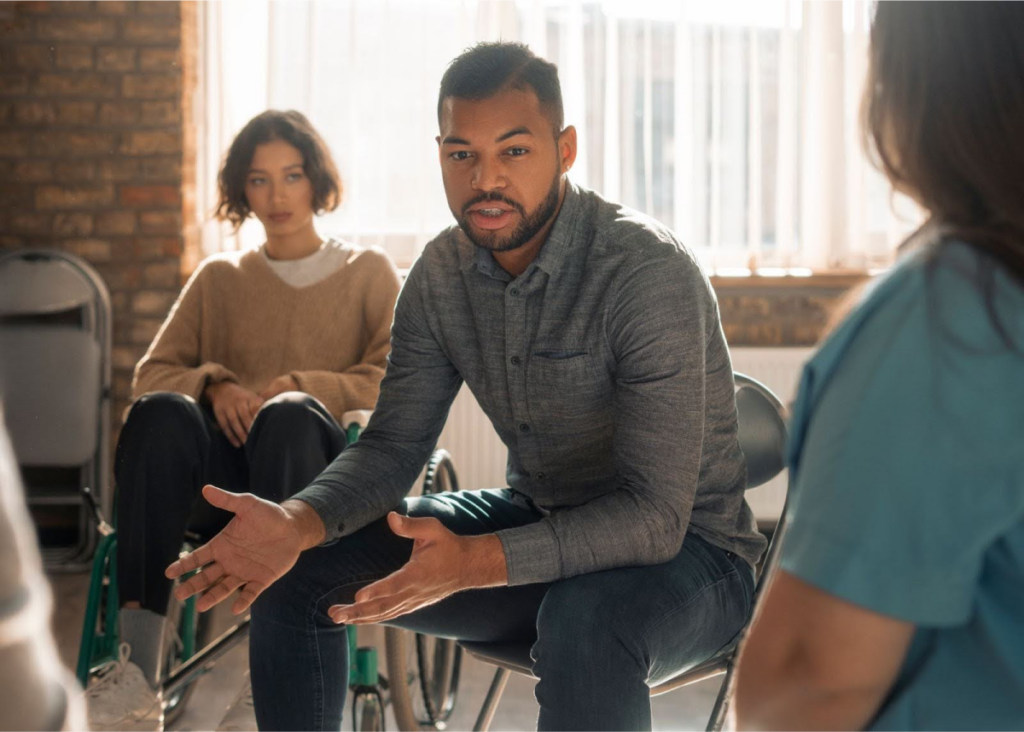 Man speaking during a group discussion.