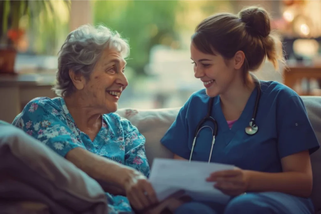 Nurse smiling with an elderly woman.