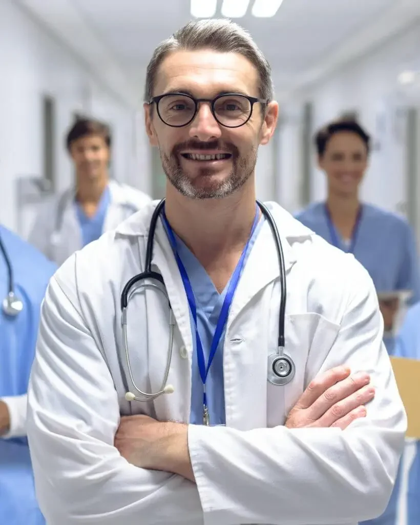 diverse-medical-team-of-doctors-looking-at-camera-while-holding-clipboard-and-medical-files